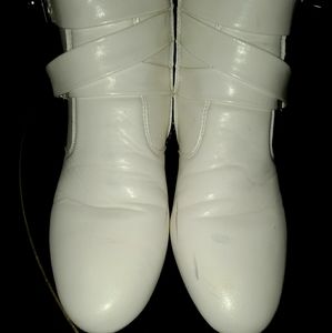Pair of white high top ankle Boots. Casual dressin